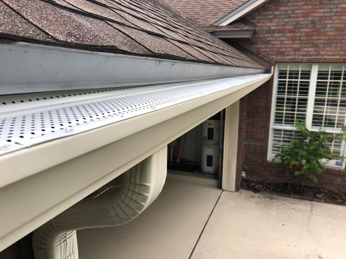 Stainless-steel gutter guards installed on a home